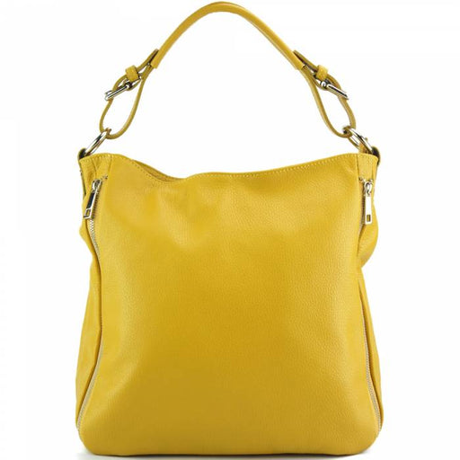 a yellow purse sitting on top of a table 