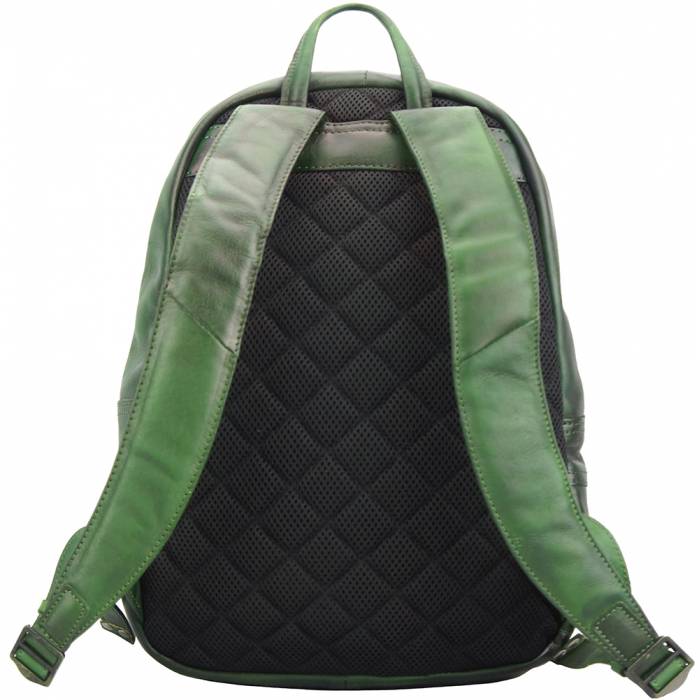 a backpack is sitting on a green bag 