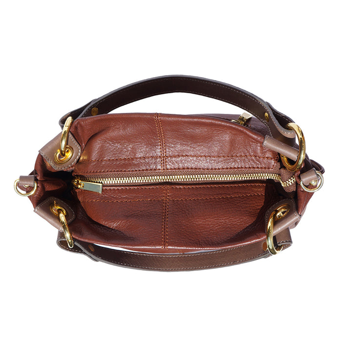 a close up of a brown leather purse 